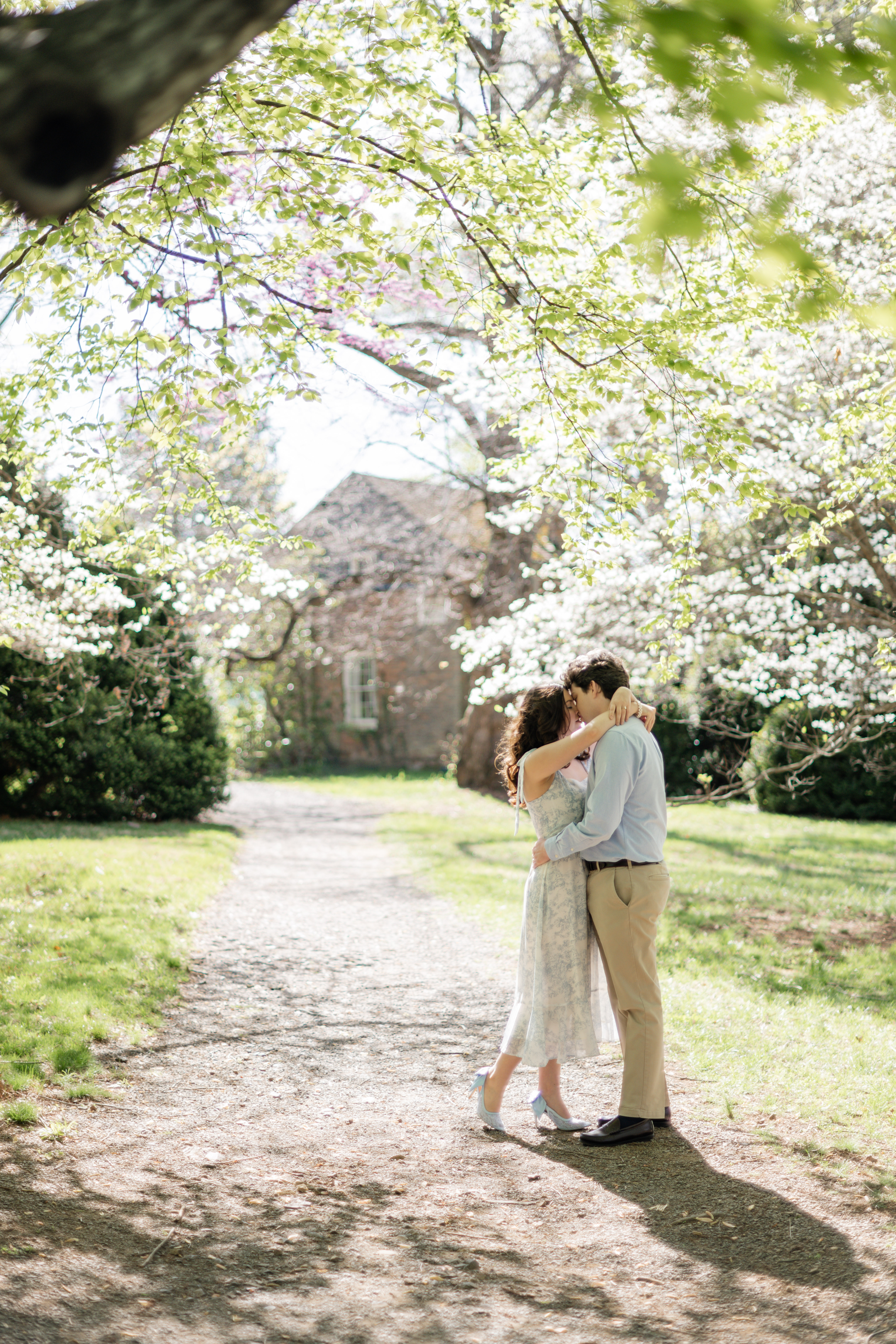 Collin and Camryn under the blossoms